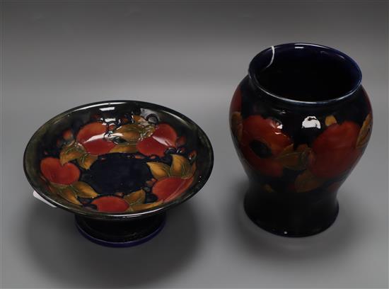 A Moorcroft Pomegranate pattern baluster vase and a similar tazza, H 17cm & Dia 18.5cm